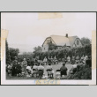 Photo of a large group meeting in a yard (ddr-densho-483-1377)