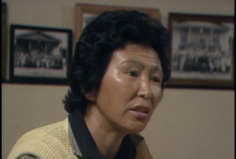 Interview with a woman of the Watsonville Issei Singers, part 2 of 2; interview with unnamed man; b-roll of Kizuka Hall exterior; Monroe Sweetland and Shig Kihara walking (ddr-densho-1007-1661)