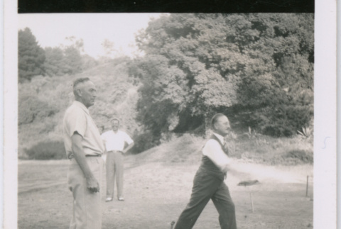 Three men playing a lawn game (ddr-densho-329-824)