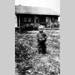 Young boy on a farm (ddr-densho-18-38)