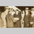 A man greeted by a crowd (ddr-njpa-1-1894)