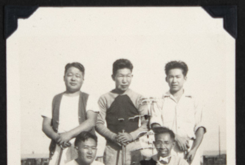 Group with golf clubs (ddr-densho-542-670)