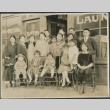 A group in front of a business (ddr-densho-321-583)