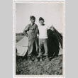 Two soldiers standing in front of tent (ddr-densho-368-40)