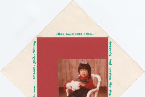 Christmas card with a child in a rocking chair (ddr-densho-430-256)