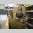 Eric Saul gives John Burden and Shig Kihara a tour of the Presidio Army Museum (ddr-densho-1007-1786)