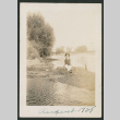 woman in swimsuit sitting on sandbar (ddr-densho-378-660)