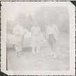 Three men standing by a car (ddr-densho-321-329)