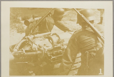 Soldiers working with a mechanical device (ddr-njpa-13-1575)