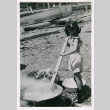 Elaine Isoshima cooking crabs (ddr-densho-477-241)