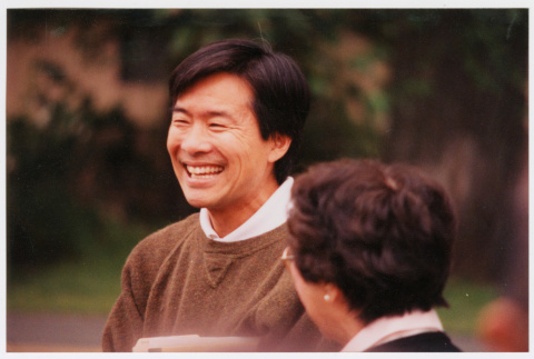 Photo of Tom Ikeda smiling (ddr-densho-506-79)