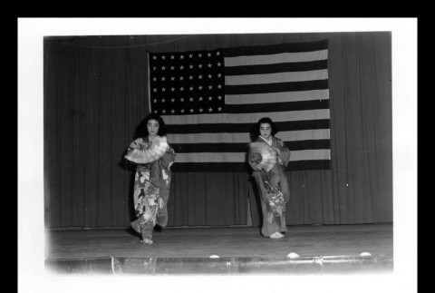Setsuko Abe Hirano (left) and cousin, Edith Abey (right) dancing Japanese buyo dance at Topaz (ddr-csujad-55-2201)