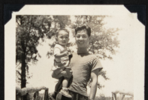 Dr. Nagata holding a child (ddr-densho-542-680)