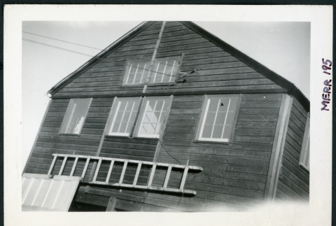 Photograph of a building with a ladder in front at Cow Creek Camp in Death Valley (ddr-csujad-47-110)