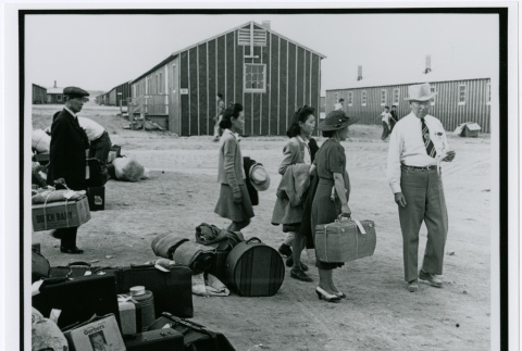 Japanese Man and Women with Luggage at Hart (sic) Mountain Relocation Camp, 1942 (ddr-densho-122-749)