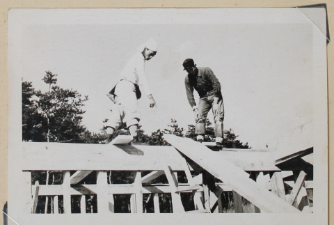 Two construction workers atop a beam (ddr-densho-433-682)