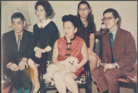 Five people, woman in center with dog (ddr-densho-523-599)