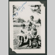 four kids sitting on wagon (ddr-densho-378-726)