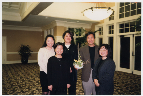 Photo of five Densho staff with floral arrangment (ddr-densho-506-110)
