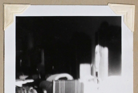 Open suitcase on a bed (ddr-densho-404-384)