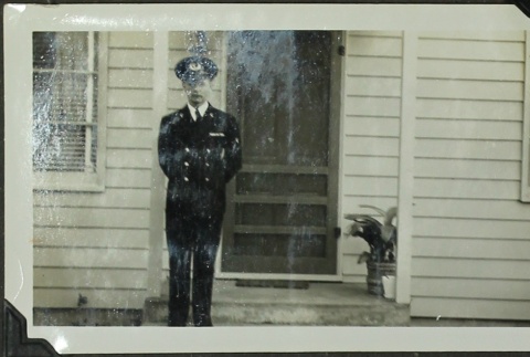 Soldier standing in front of house (ddr-densho-201-347)