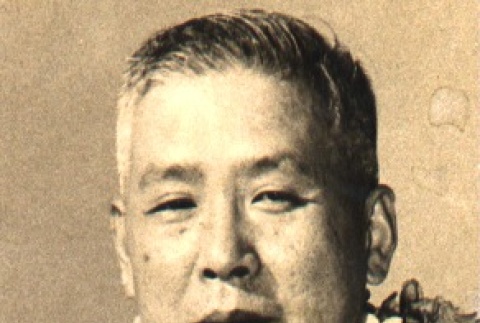 Utashito Nakashima wearing leis (ddr-njpa-4-1317)