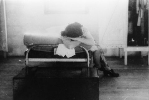 [Girl resting in Children's Village barrack] (ddr-csujad-29-319)