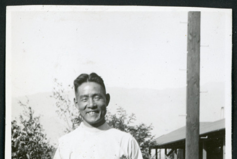 Photograph of smiling male hospital staff posing in front of the Manzanar hospital (ddr-csujad-47-198)