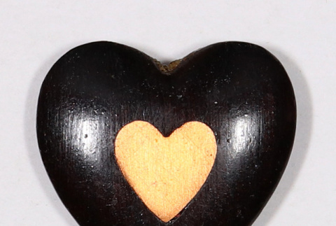 Carved wood heart with inner yellow heart (ddr-densho-475-159)