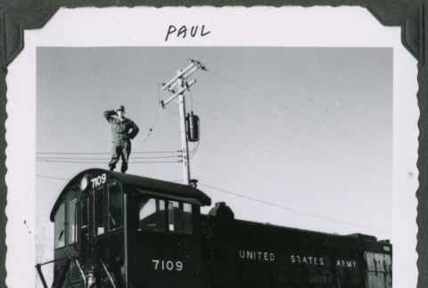 Paul Ohashi atop a caboose (ddr-densho-442-159)
