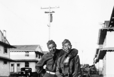Joe Iwataki and friend standing outside barracks (ddr-ajah-2-759)
