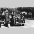 Japanese Americans riding on a truck (ddr-densho-34-31)