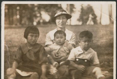 Photo of a woman with three children (ddr-densho-483-929)