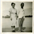 Couple standing in front of barracks (ddr-manz-6-1)
