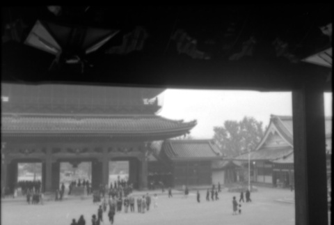 View of courtyard and large gate, taken from inside a building (ddr-densho-426-2331)
