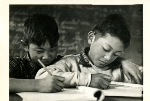 Two boys writing (ddr-csujad-26-92)