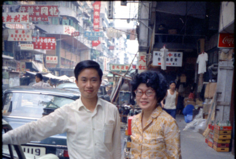Martha (Nozawa) Tsuchida and unknown man standing by car (ddr-densho-426-749)
