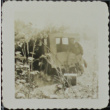 Man next to an abandoned vehicle (ddr-densho-321-1388)