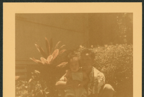 Nisei man poses with child (ddr-densho-363-304)