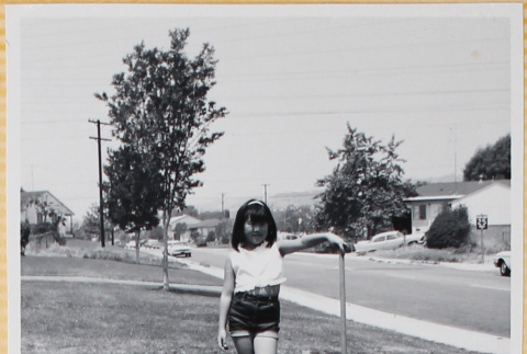 Girl standing in yard (ddr-densho-522-104)