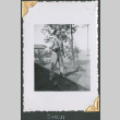 Man holding pole (ddr-densho-434-168)