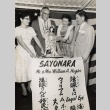 Two couples admiring a Japanese doll (ddr-njpa-2-422)