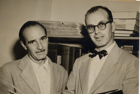 Two men holding a book (ddr-njpa-2-465)