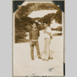 Two men hiking in snow (ddr-densho-383-136)