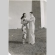 Man placing a lei on Miss Hawaii at the Washington Monument (ddr-njpa-2-840)