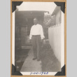 Man standing on a sidewalk (ddr-densho-542-212)