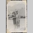 Couple standing outside tents (ddr-densho-466-899)