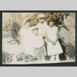 two boys and two girls outside in a yard (ddr-densho-378-691)