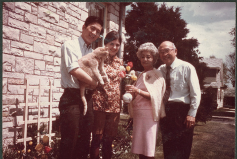 Agnes and Chester Sakura with young couple holding cat (ddr-densho-523-522)