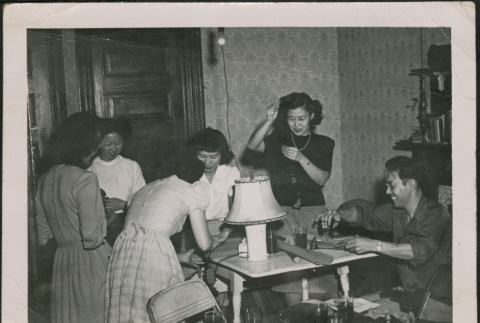 Group of women and a man around table (ddr-densho-293-158)